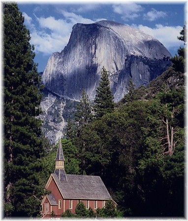 Photo of the Yosemite Valley Chapel with Half Dome behind it
           (Dan Warsinger Photography)